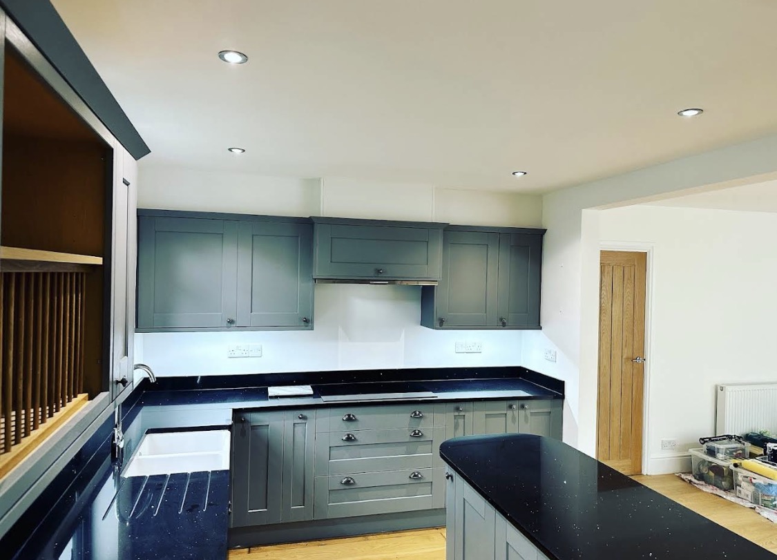 Blue-grey kitchen reverse view — tools visible